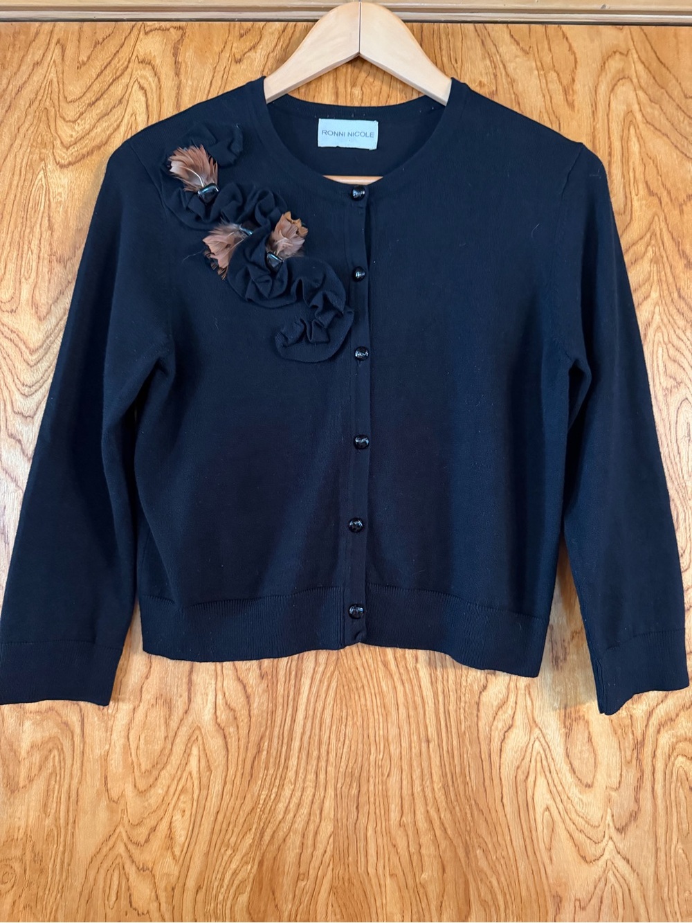 Ronni Nicole Black Cardigan with Brown Feather Rosette Accents